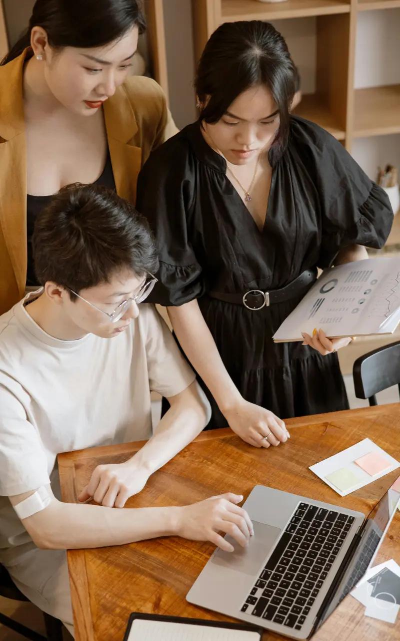 Three people discussing work