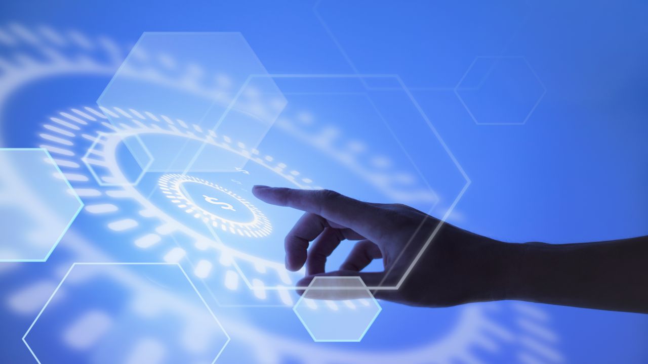 Hand pointing at currency in payment terminal