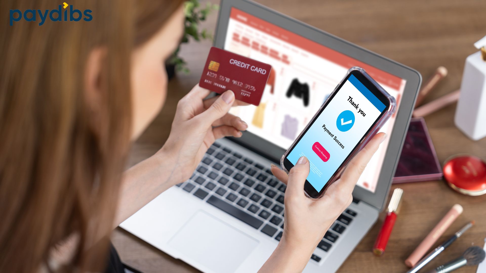 Customer completing an online payment using credit card and mobile phone on an e-commerce website