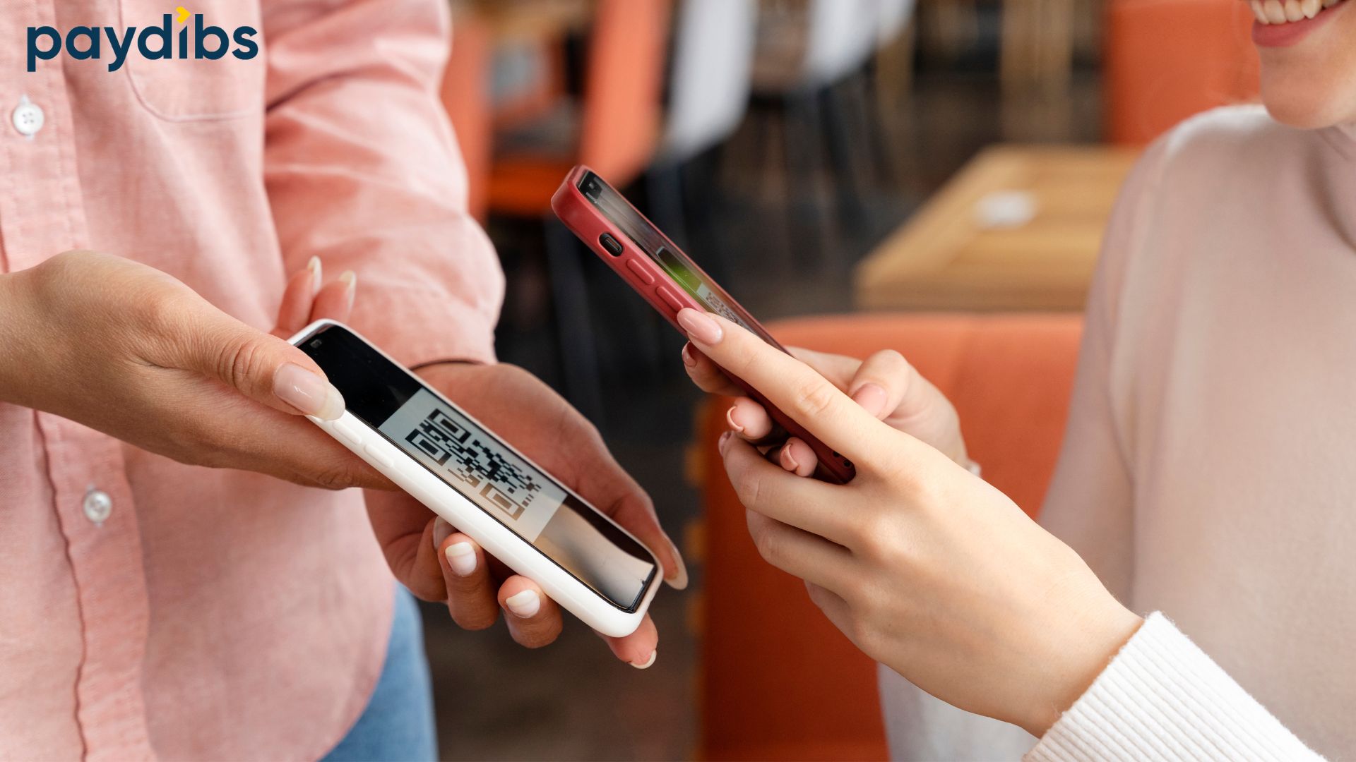 A women holding phone to scan the QR show on the payment gateway terminal.