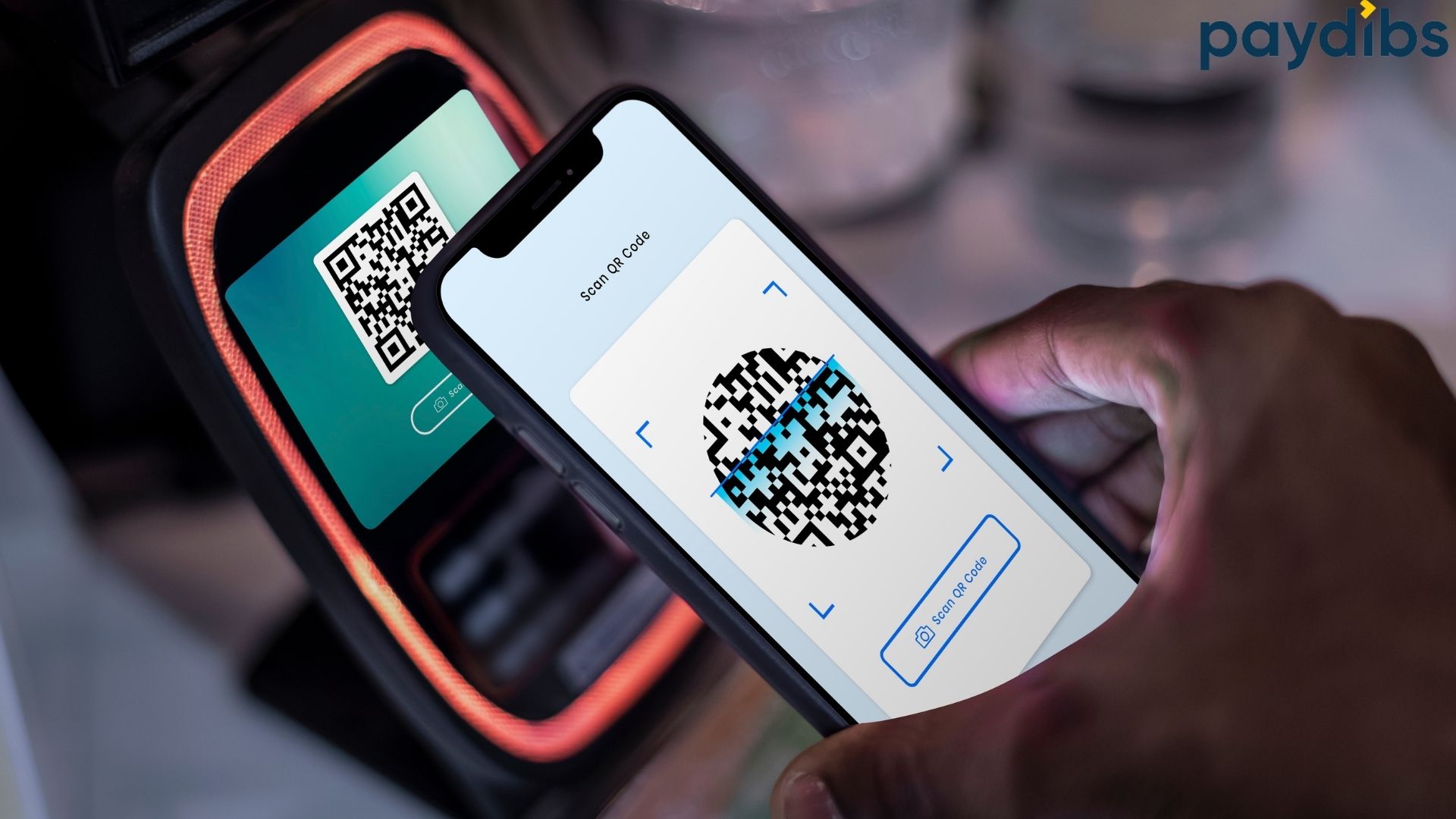 A phone is using to pay by QR code and NFC
