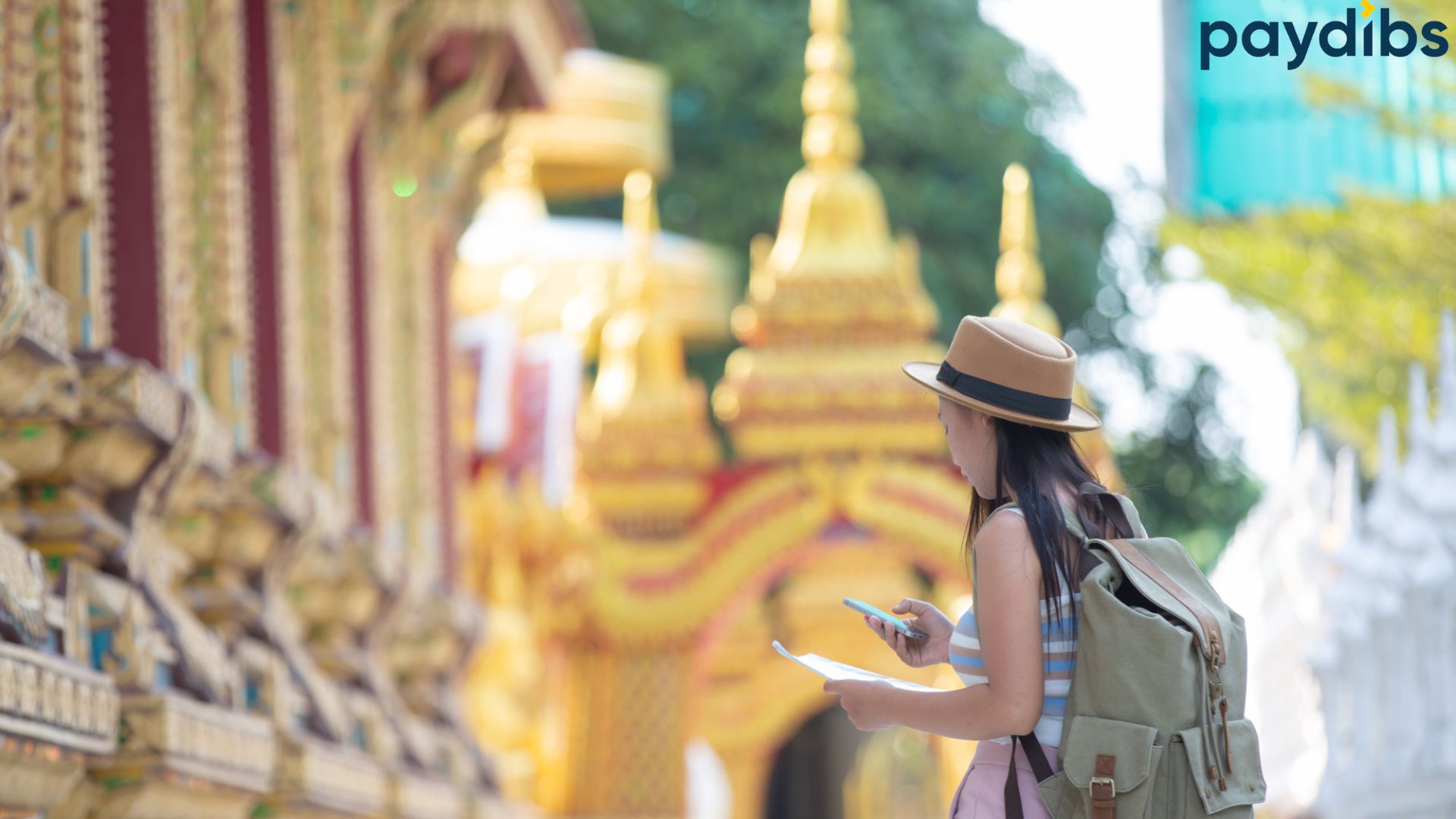 A woman travelling in Thailand checking the maps direction on her mobile device
