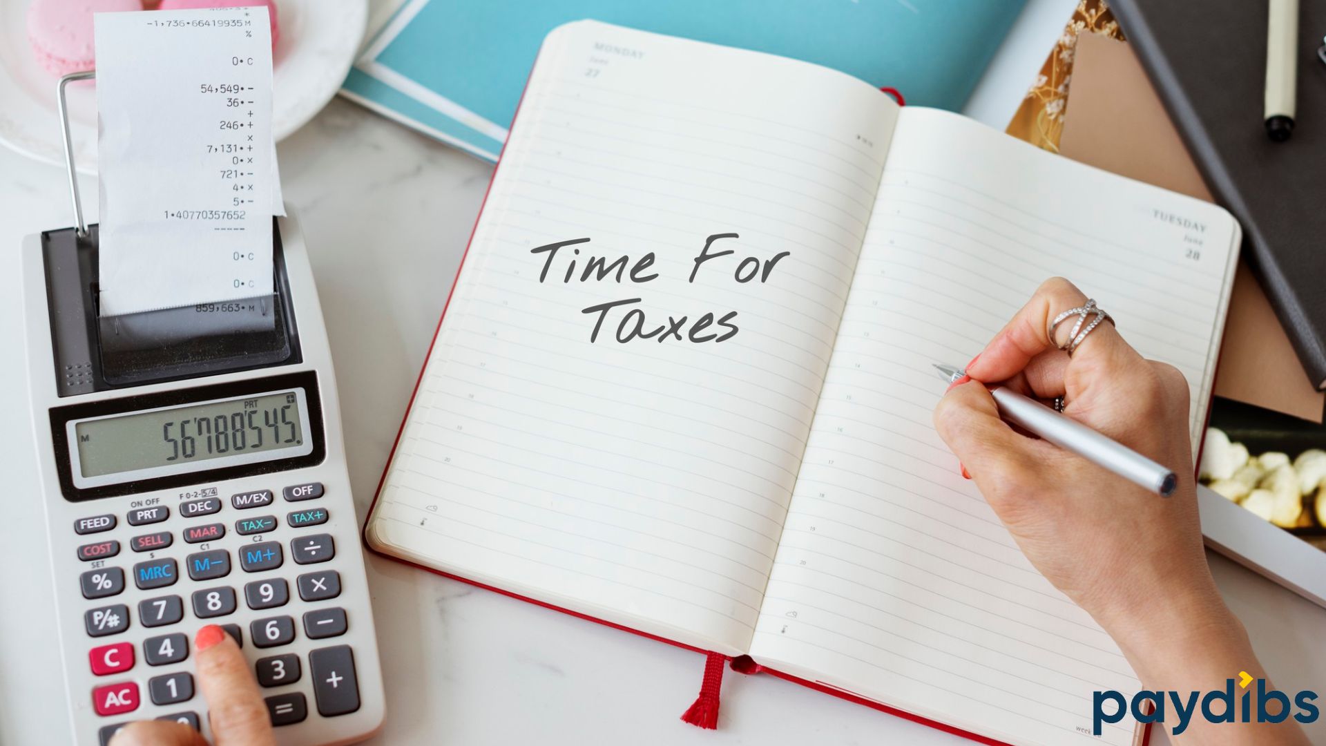A woman hands writing on notebook :"Time For Taxes" and calculating using calculator prepare for tax reporting