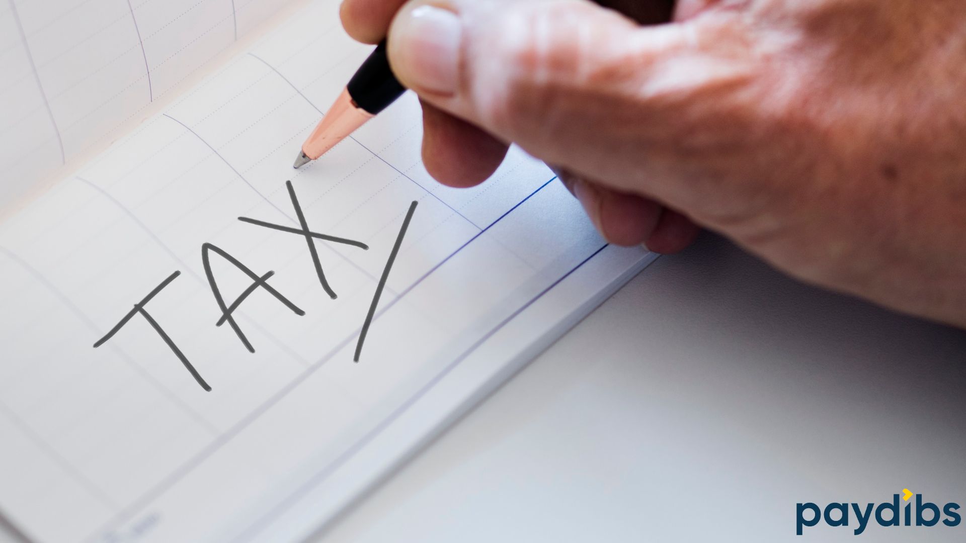 A hand holding pencil and wrote "TAX" on paper. Ready to check TIN number for tax filing