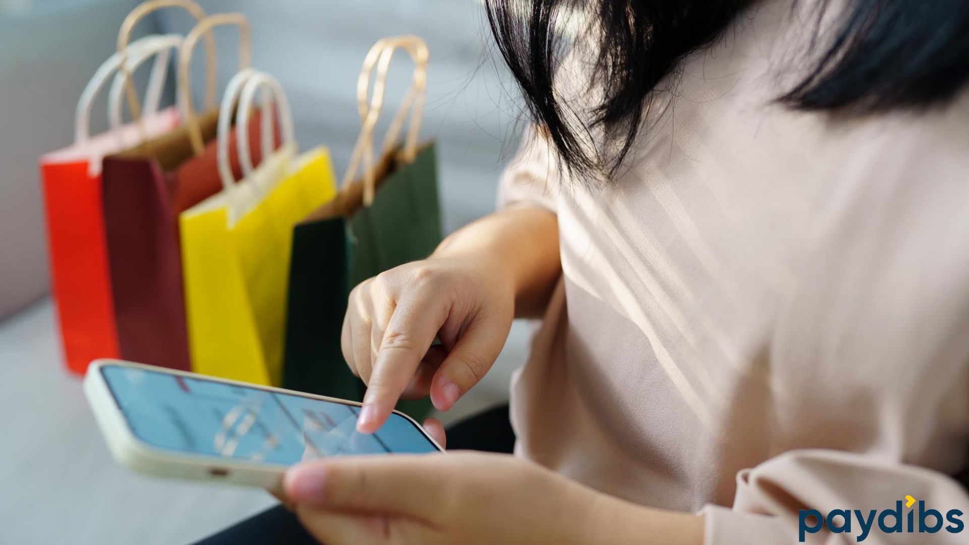 Woman shopping online using mobile phone buy now pay later