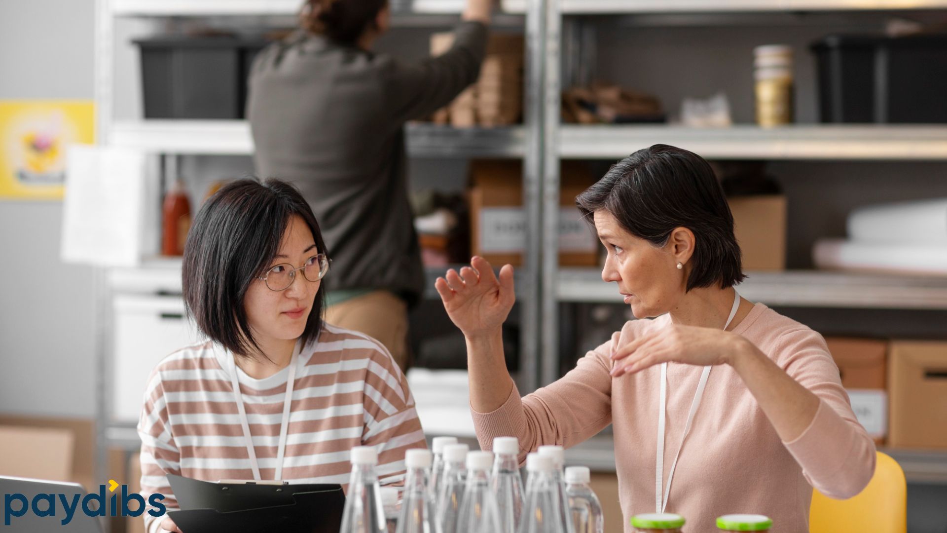 Colleague explaining automating b2b payments to her peer