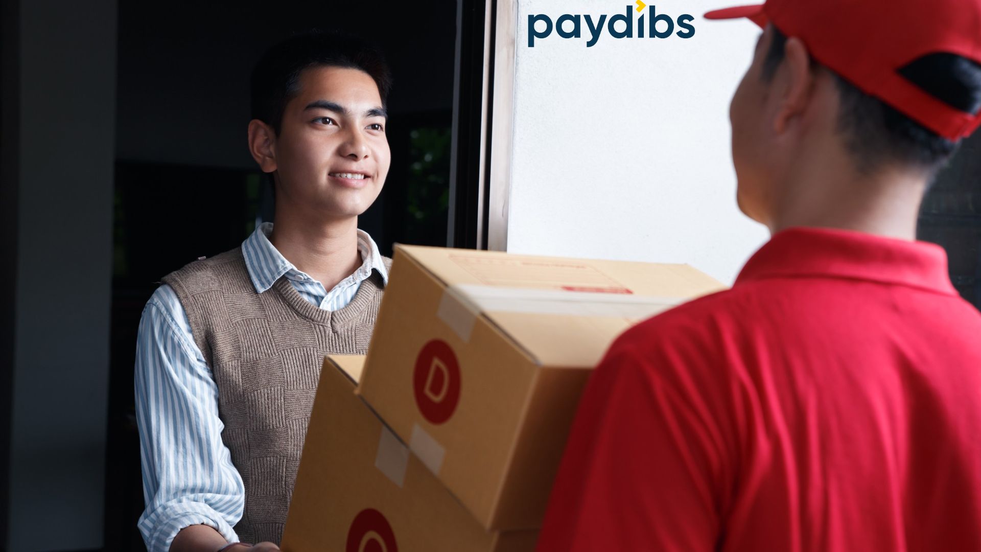 A man receiving parcel from delivery man and completed the payment with COD